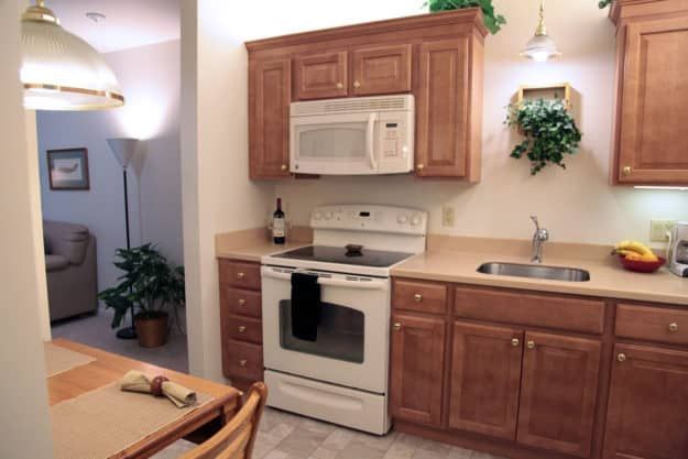 Interior design of Silver Maples senior living community kitchen with appliances and fresh produce.