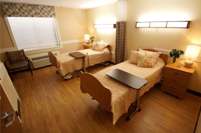 Interior view of Quince Nursing and Rehabilitation Center showcasing hardwood flooring, furniture, and decor.