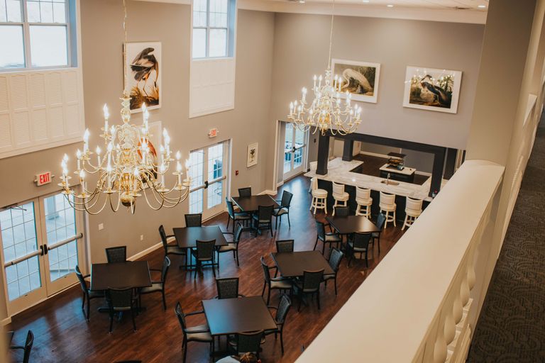 Interior view of Chandelier senior living community in Carbondale featuring dining area and art.